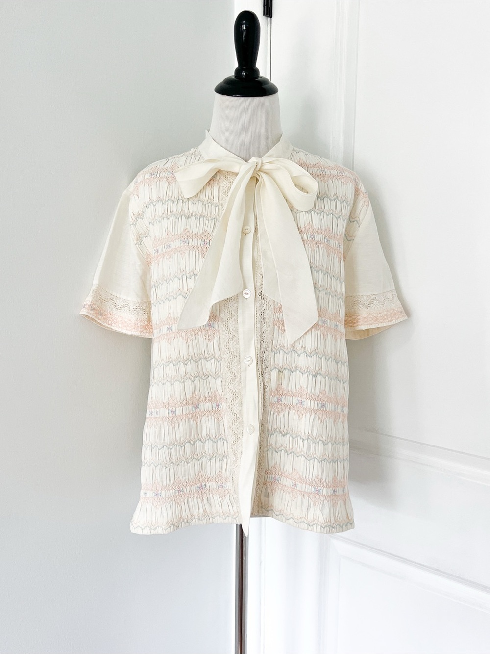 Lily Cream Bow-Tie Short Sleeve Blouse with Embroidered Lace & Smocked Front
